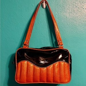 Trophy Queen tuck & roll purse